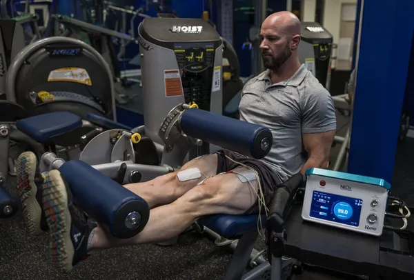 Chris training on leg press with NXPro