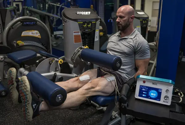 Chris training on leg press with NXPro