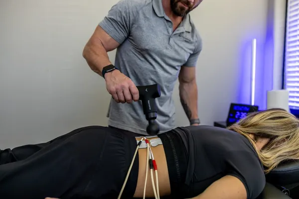 Chris performing bodywork treatment on client